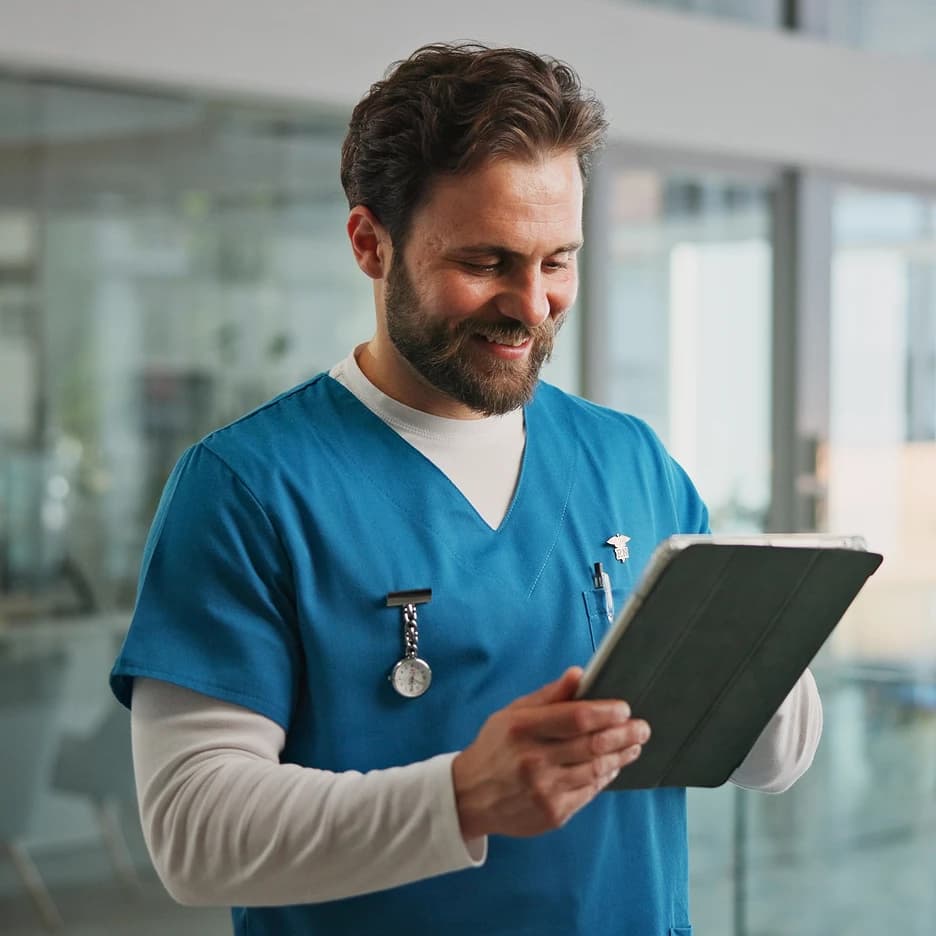 Healthcare professional using AsterMD on a tablet